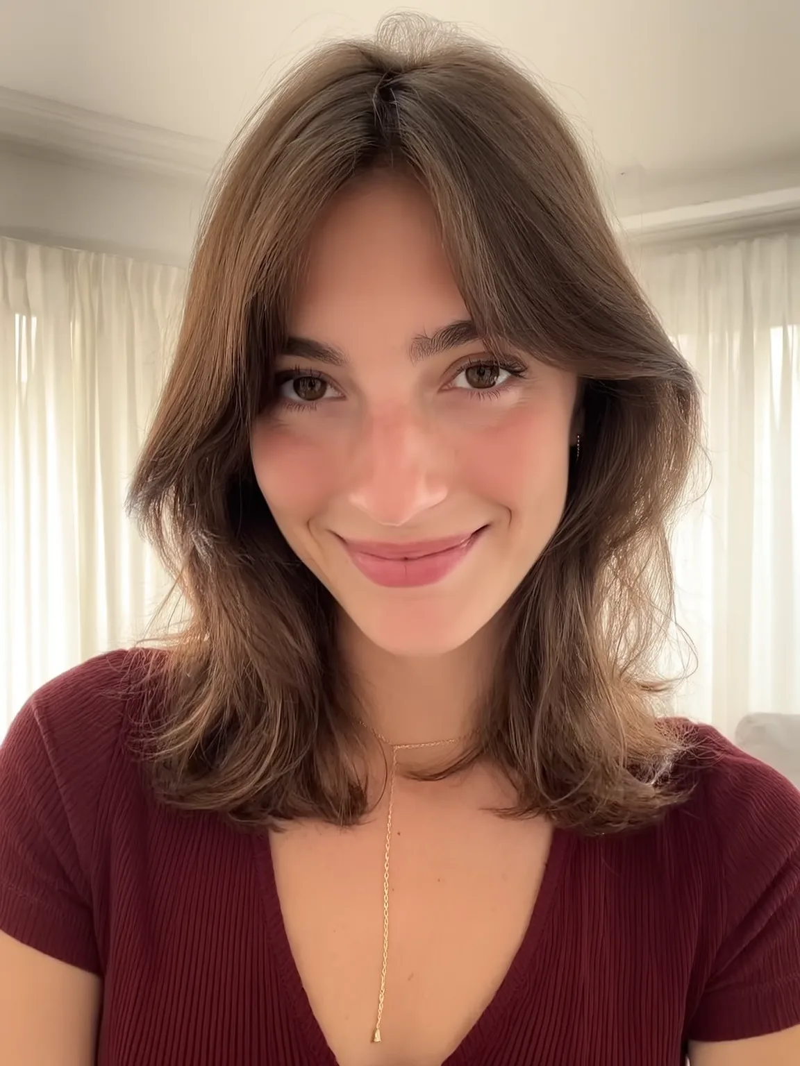 Soft Layered Shoulder-Length Cut with Curtain Bangs